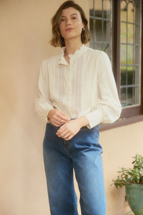 Mandarin collar
Button-down
Bishop sleeves with button cuff
Pintuck detailing
Lattice lace trim
High-low hem
Easy fit
85% Viscose, 15% Linen
Trim: 100% Polyester