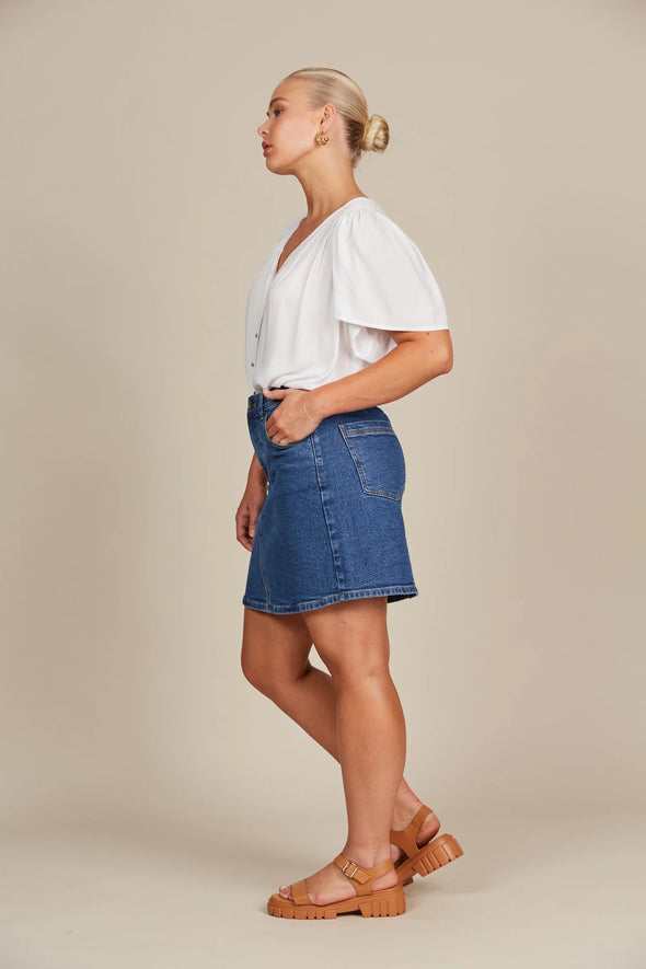 If you prefer skirts to pants, the Margot Denim Skirt is your go-to for laid-back days. This denim skirt features a mid-rise fit, button and zipper fly, and classic five-pocket styling. Falling to a comfortable mid-thigh length, it has the right amount of stretch for all-day comfort. Whether you pair it with a tank, t-shirt, button-down, or blouse, you'll always look chic and stylish!