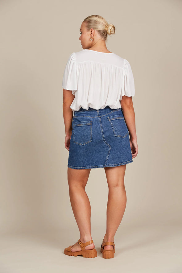 If you prefer skirts to pants, the Margot Denim Skirt is your go-to for laid-back days. This denim skirt features a mid-rise fit, button and zipper fly, and classic five-pocket styling. Falling to a comfortable mid-thigh length, it has the right amount of stretch for all-day comfort. Whether you pair it with a tank, t-shirt, button-down, or blouse, you'll always look chic and stylish!