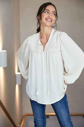 Step into winter style with the Romance Blouse. This blouse boasts understated elegance with its silk-like fabric offering a touch of luxury. Versatility is its strength - pair it casually with denim for brunch or tuck it into a maxi skirt, throw on a blazer, and conquer office chic. This blouse promises to be your winter go-to, effortlessly blending comfort and sophistication