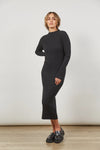 You know you've found the perfect dress when you can seamlessly transition it from day to night. The ribbed, figure-hugging silhouette of the Skyline Knit Dress enhances your curves, while the mock turtleneck and long sleeves add a touch of sophistication. The soft fabric ensures comfort in cooler weather, making it an ideal choice for any occasion. Elevate your look with a coat, boots, and glam accessories.