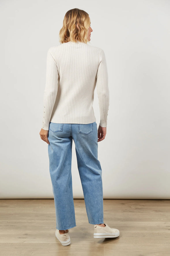 Elevate your everyday essentials with the Skyline Knit Top. Whether you're dressing for a workday or a casual weekend outing, this soft knit blend ensures a figure-hugging silhouette. With a mock turtleneck, long sleeves, and a hip-length fit, pair it effortlessly with jeans and sneakers for the ultimate daytime chic.