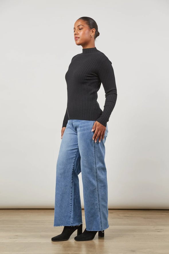 Elevate your everyday essentials with the Skyline Knit Top. Whether you're dressing for a workday or a casual weekend outing, this soft knit blend ensures a figure-hugging silhouette. With a mock turtleneck, long sleeves, and a hip-length fit, pair it effortlessly with jeans and sneakers for the ultimate daytime chic.