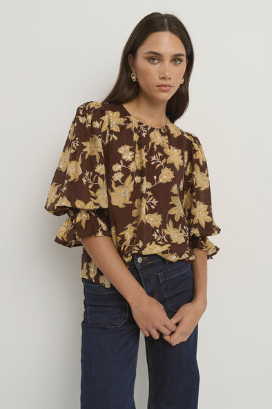 -Pull-on style with a round neckline for fuss-free wear
- Relaxed silhouette with soft gathers for a floaty finish
- Voluminous short sleeves with ruffle detail at the cuff
- All-over floral print in warm chocolate and khaki tones
- 70% Viscose 30% Nylon