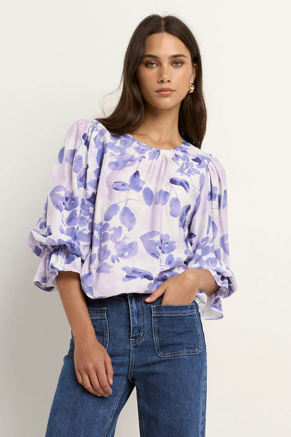 Meet the Candid Ivory Top—romance meets whimsy in soft blue hues and playful floral prints. Its flutter sleeves and relaxed fit bring effortless charm, making it a breeze to style with denim or layer under a blazer. Ready to add a touch of polished fun to your outfit without any fuss? This top’s got you covered!
