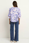 Meet the Candid Ivory Top—romance meets whimsy in soft blue hues and playful floral prints. Its flutter sleeves and relaxed fit bring effortless charm, making it a breeze to style with denim or layer under a blazer. Ready to add a touch of polished fun to your outfit without any fuss? This top’s got you covered!