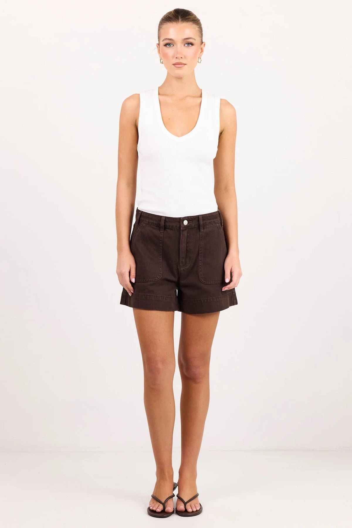 - High-rise waist
- Rigid denim
- Front patch pockets
- Belt loops
- Button and zip fastening
- Relaxed leg
- Dark chocolate wash
- Wash before wear
- Fabric Composition - 100% Cotton