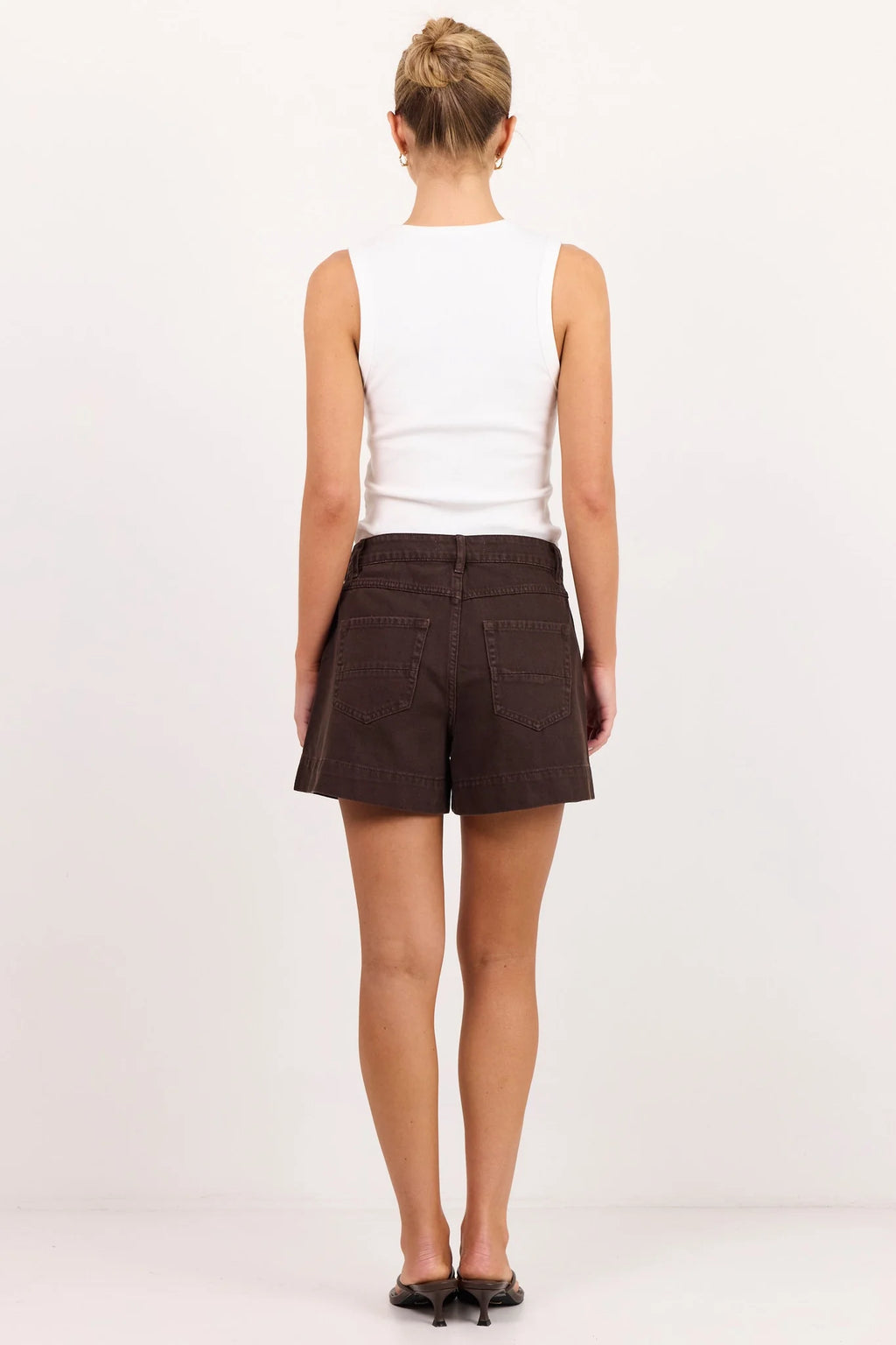 - High-rise waist
- Rigid denim
- Front patch pockets
- Belt loops
- Button and zip fastening
- Relaxed leg
- Dark chocolate wash
- Wash before wear
- Fabric Composition - 100% Cotton
