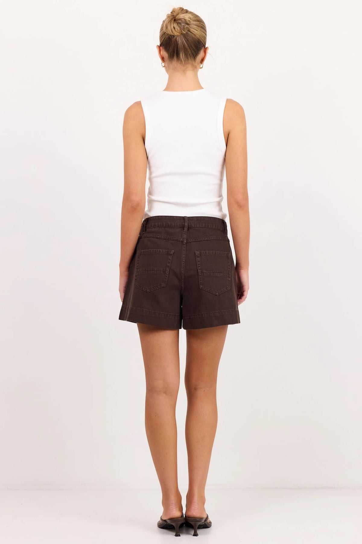- High-rise waist
- Rigid denim
- Front patch pockets
- Belt loops
- Button and zip fastening
- Relaxed leg
- Dark chocolate wash
- Wash before wear
- Fabric Composition - 100% Cotton