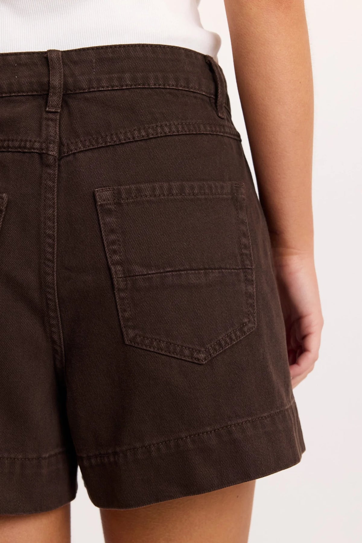 - High-rise waist
- Rigid denim
- Front patch pockets
- Belt loops
- Button and zip fastening
- Relaxed leg
- Dark chocolate wash
- Wash before wear
- Fabric Composition - 100% Cotton