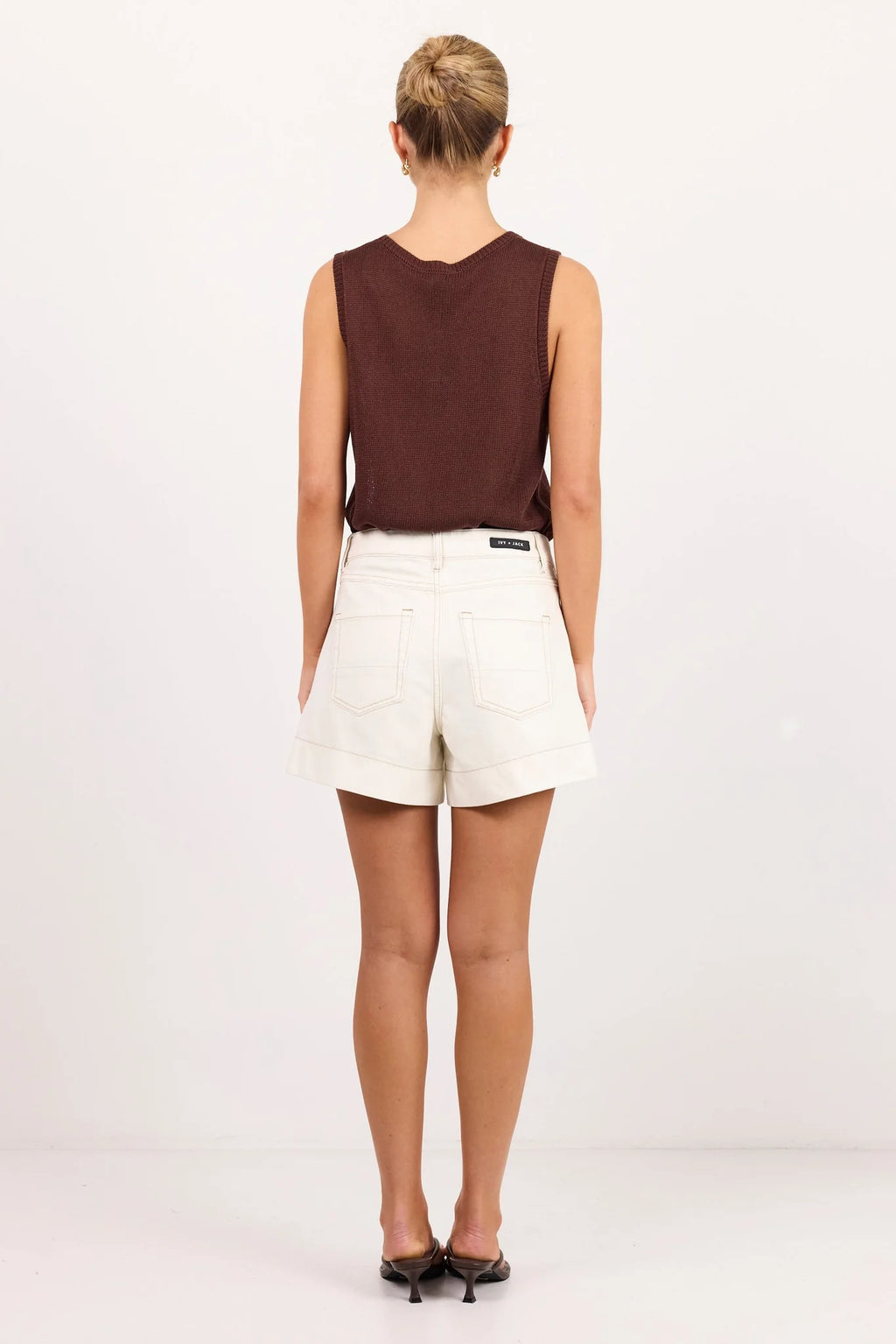 - High-waisted fit gives a flattering silhouette
- Front pockets and contrast stitching add modern detail
- Zip closure for a clean, classic finish
- Fabric - 100% Cotton