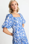 Make a statement in the Tranquillity Blue Batik Cut Out Tiered Midi Dress. With its shirred cut out back and flattering tiered design, this dress is perfect for any occasion. Elegant puff sleeves and a lightweight viscose blend add a touch of summer sophistication. Get ready to turn heads! Team up with your fav sandals for a summer outfit or add a heel for that special event.