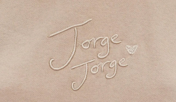 Introducing the Jorge Heart Fleece, a fun and playful addition to your wardrobe. Cozy up in style with a basic tank, denim jeans, and white sneakers. (Get ready to receive compliments!)