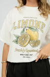 Brighten your day with the Jorge Limone Tee in Vintage White! This cool, relaxed tee features a classic crew neckline and playful vintage-style lemon graphic that’s bursting with personality. Short sleeves with extended shoulders and a straight hem complete the easy oversized fit. Perfect for sunny days—team it with denim shorts for a timeless summer vibe, or mix with wide-leg trousers and sandals to step up your casual style. Made from 100% cotton, it’s as comfy as it is fun!