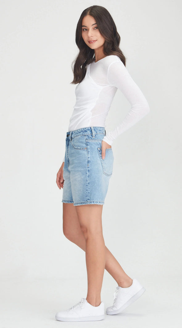 Mid/high waisted rigid denim A line denim shorts.

Ngaio Blue is a great mid length option that is not too long &amp; not too short. In a perfect Blue colour. Can be worn baggy or more fitted as preferred.&nbsp;