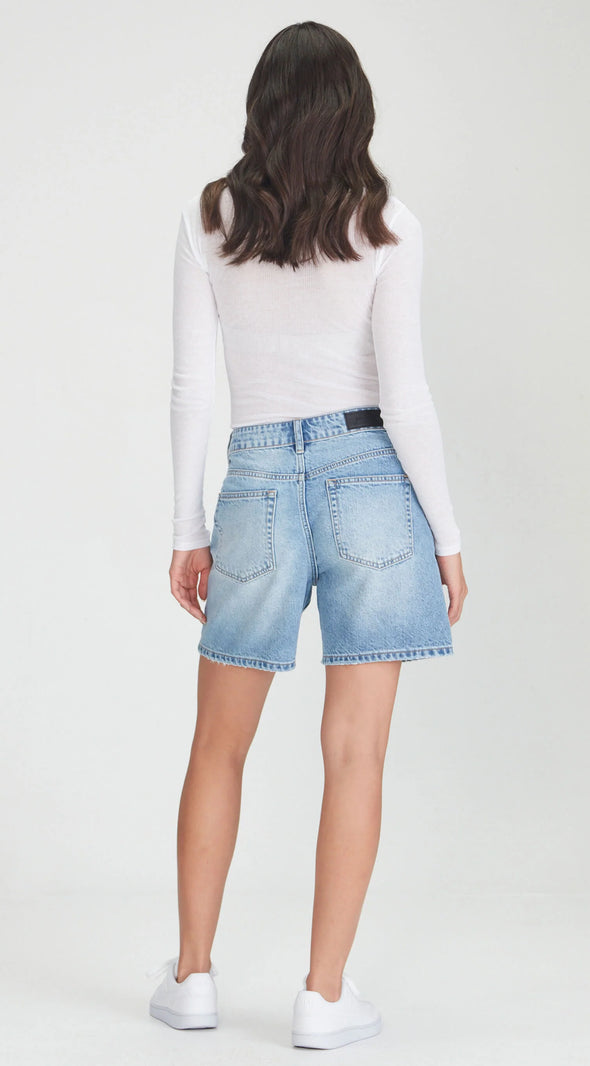 Mid/high waisted rigid denim A line denim shorts.

Ngaio Blue is a great mid length option that is not too long &amp; not too short. In a perfect Blue colour. Can be worn baggy or more fitted as preferred.&nbsp;