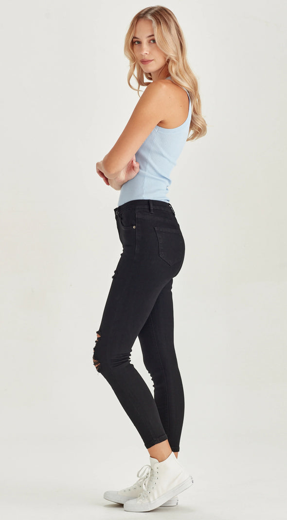 Mid/High waisted stretch denim skinny jean with rips.