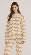 Introducing the Brooke Crochet Sweater - luxuriously soft and effortlessly chic. Its vintage-inspired zig-zag pattern and earthy tones bring a touch of '70s glamour to any outfit. With its relaxed silhouette and scalloped hem, this statement piece is perfect for both casual and coordinated looks. Embrace laid-back elegance with the Brooke Crochet Sweater.