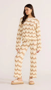 Introducing the Brooke Crochet Sweater - luxuriously soft and effortlessly chic. Its vintage-inspired zig-zag pattern and earthy tones bring a touch of '70s glamour to any outfit. With its relaxed silhouette and scalloped hem, this statement piece is perfect for both casual and coordinated looks. Embrace laid-back elegance with the Brooke Crochet Sweater.