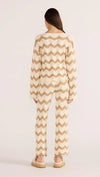 Introducing the Brooke Crochet Sweater - luxuriously soft and effortlessly chic. Its vintage-inspired zig-zag pattern and earthy tones bring a touch of '70s glamour to any outfit. With its relaxed silhouette and scalloped hem, this statement piece is perfect for both casual and coordinated looks. Embrace laid-back elegance with the Brooke Crochet Sweater.