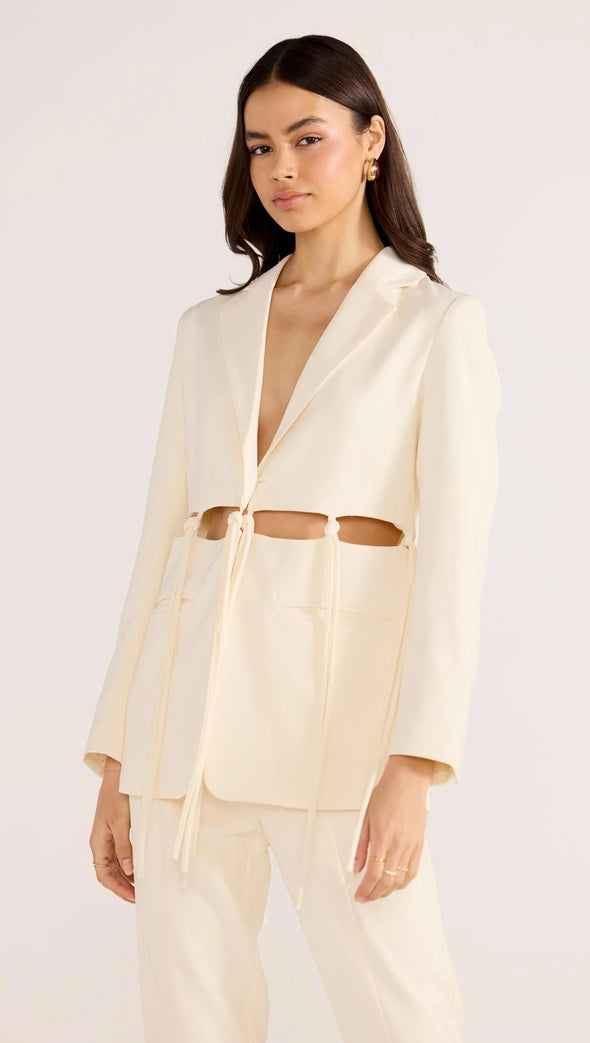 Introducing the Maeve Tie Blazer, a modern take on power dressing. With its structured tailoring and unique cut-out tie details, this blazer exudes sophistication and edge. Complete the look with the Maeve Panel Pant for a powerful suiting ensemble. Elevate your style with this exclusive piece.