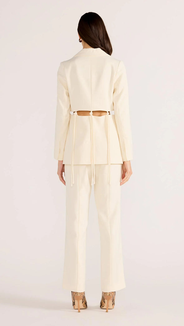 Introducing the Maeve Tie Blazer, a modern take on power dressing. With its structured tailoring and unique cut-out tie details, this blazer exudes sophistication and edge. Complete the look with the Maeve Panel Pant for a powerful suiting ensemble. Elevate your style with this exclusive piece.