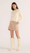 Introducing the Rowan Fluffy Cardi in ivory, a cozy and feminine addition to your wardrobe. Crafted from a super-soft, brushed knit, this timeless cardigan exudes effortless refinement. Wear it over a slip dress, with denim, or pair it with a Mini Skirt for a sophisticated mix of texture and polish.v