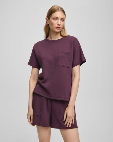Oversized fit

Model is 179cm and wears a size S/M

5% Elastane

Soft, sustainable blend with stretch

Relaxed, oversized fit

Front pocket and wide short sleeves

Perfect for matching with the Harissa Shorts