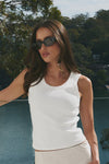 Sleeveless design for breathable comfort

Stretchy rib knit with a snug, flattering fit

95% cotton, 5% elastane for softness and stretch

Pairs effortlessly with skirts, pants, and shorts