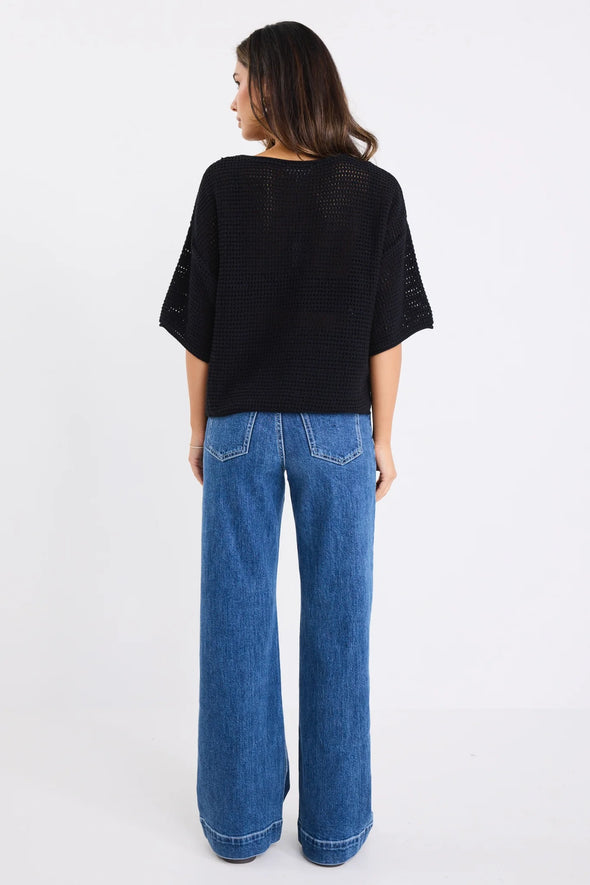 100% natural cotton for breathable comfort
- Textured open knit
- Relaxed boxy silhouette with short sleeves
- Lightweight and perfect for layering across seasons
- Natural Fibres
