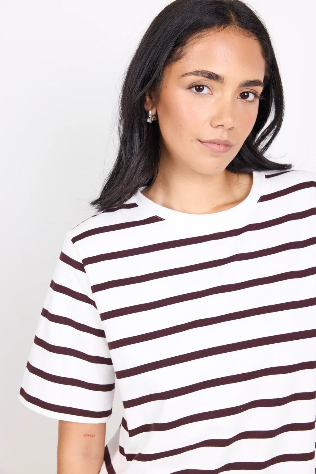 Brown and white stripe design

Oversized boxy fit for a modern silhouette

Short sleeve

Fabric Composition - 100% Cotton