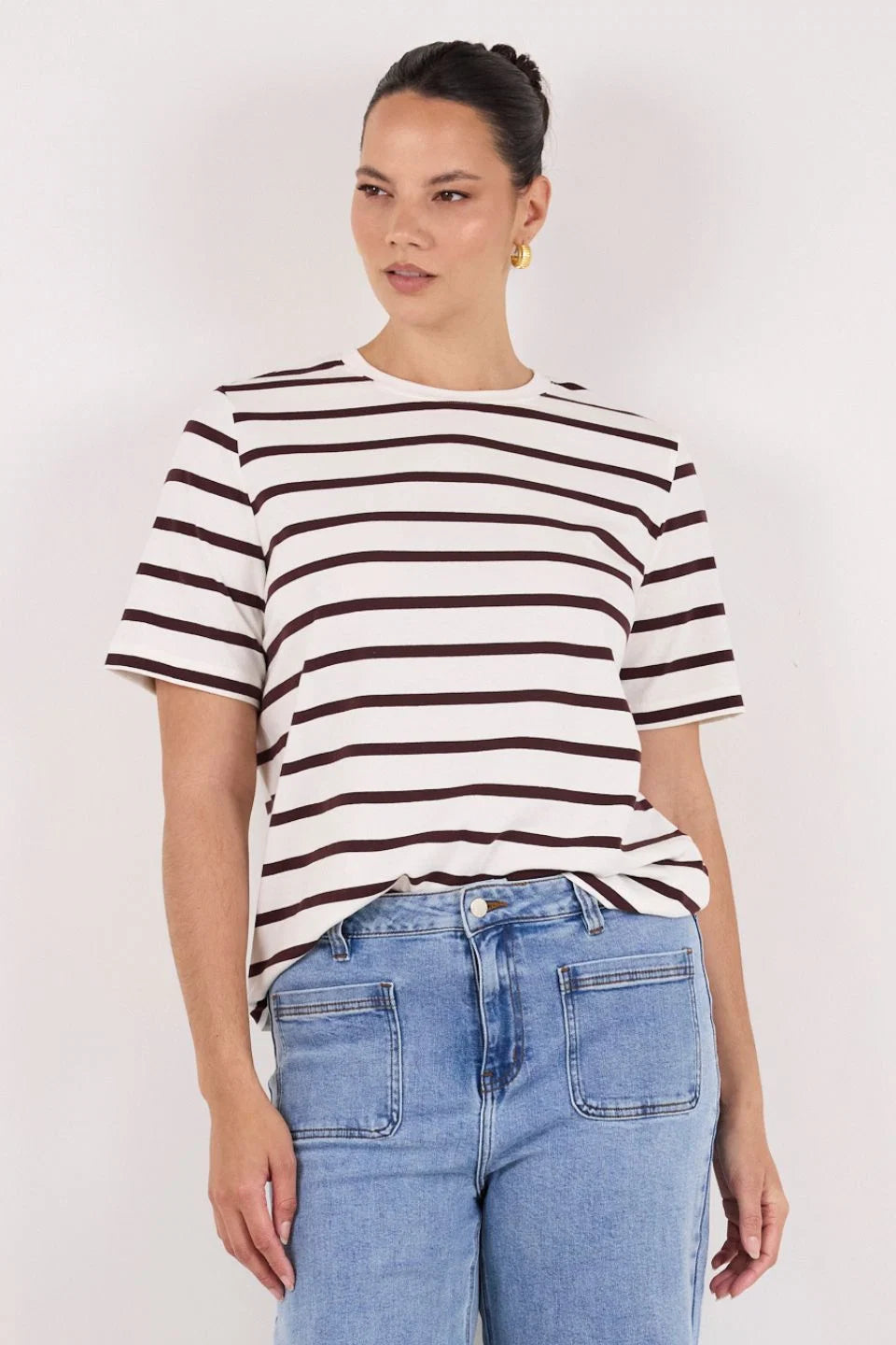 Brown and white stripe design

Oversized boxy fit for a modern silhouette

Short sleeve

Fabric Composition - 100% Cotton