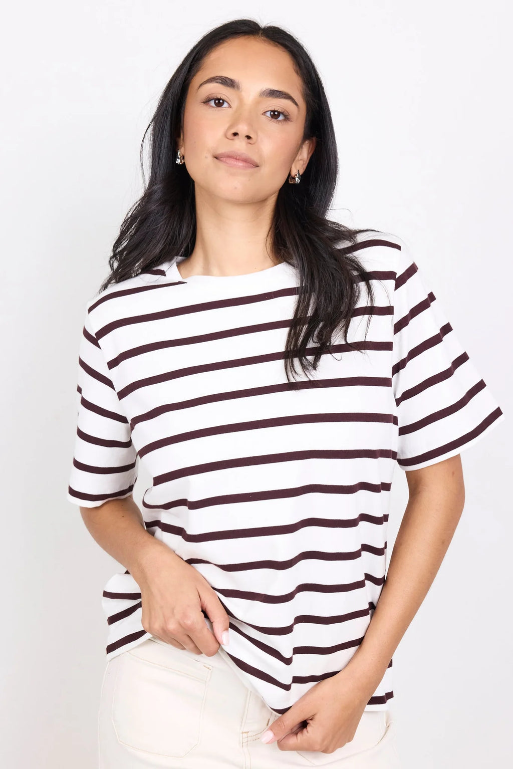 Brown and white stripe design

Oversized boxy fit for a modern silhouette

Short sleeve

Fabric Composition - 100% Cotton
