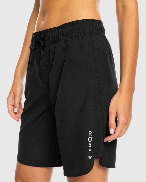 Get ready to hit the waves with our women's black boardshorts. Made with a 4-way stretch fabric blend, these boardshorts offer comfort and flexibility in the water. The fully elasticated waist and drawcord closure provide a secure fit, while the side pockets offer convenience and the 9 inch length giving plenty of leg cover from the hot sun. Finished with the Roxy screen logo at the leg opening, these boardshorts can be worn on land or water they're that comfortable you'll find any excuse to slip into these