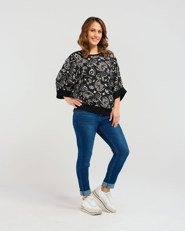 Indulge in effortless everyday luxury with this relaxed-fit top. Adorned in a white paisley print with a sleek black base, and finished with striking black cuffs, it exudes effortless style. With its 3/4 sleeves and comfortable fit, it's the perfect choice for any occasion. So simple to style you will find yourself reaching for the Florence top time and time again.