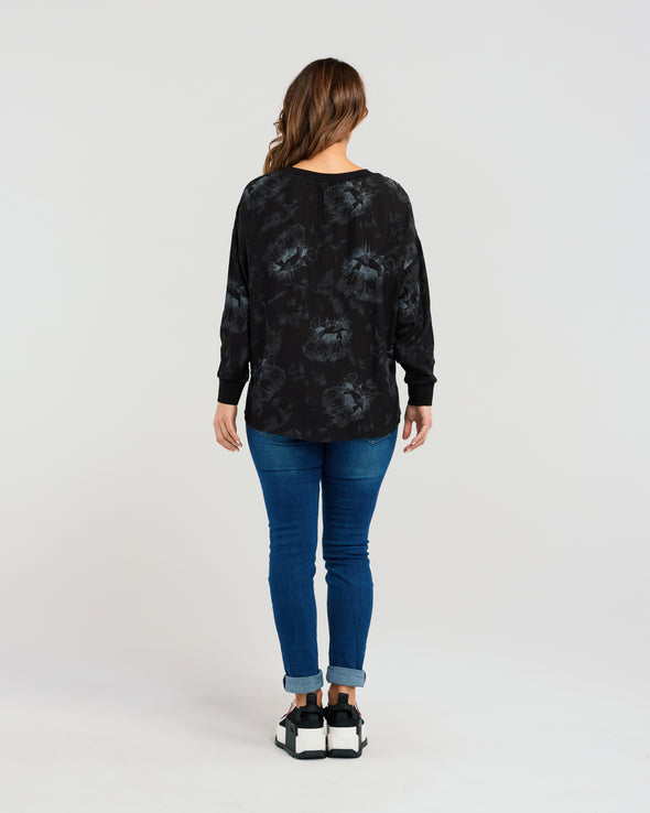 Effortlessly embrace laid-back luxury with the Isla Top. Refined with the Shadow Garden print - easily pair back with denim or a black pant for a tonal design. Fit for comfort and versatility, this loose-fit top features a round neckline and a soft floral pattern keeping things subtle. Its relaxed silhouette and neutral colour palette make it a must-have for any wardrobe.