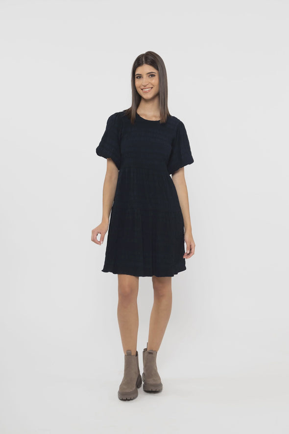 Indulge in the luxurious feeling of the Seeking Lola Carefree Mini Dress! Crafted with a sumptuous dark navy fabric, this dress is both flattering and comfortable. Perfectly sized for a true fit, you will love how it looks and feels on you. Elevate your wardrobe with this must-have dress!