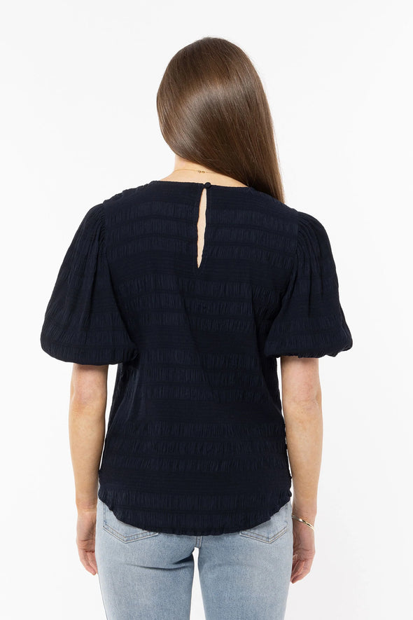 Stand out in the crowd with this beautiful top&nbsp;from Seeking Lola.

This is a wardrobe MUST have, this season.&nbsp; It oozes femininity thanks to the versatile colour and it's shapely cut which is exaggerated by the puff 1/2 sleeve and the textural quality of the fabric.