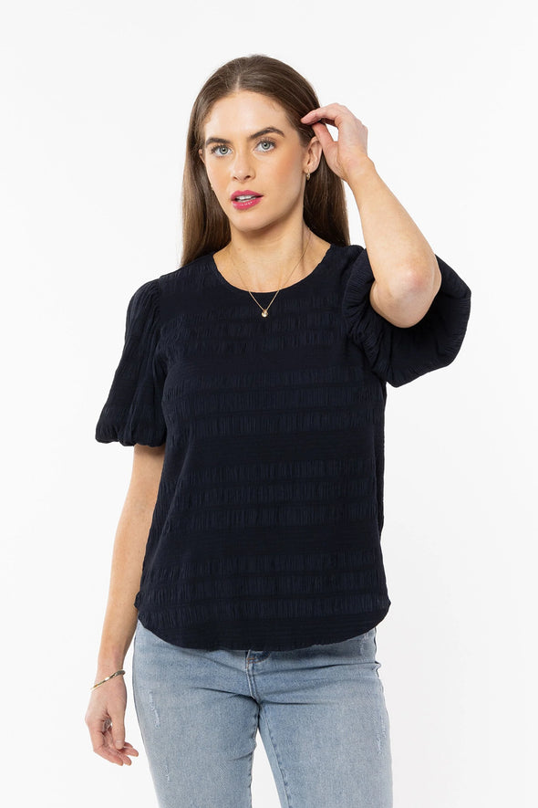 Stand out in the crowd with this beautiful top&nbsp;from Seeking Lola.

This is a wardrobe MUST have, this season.&nbsp; It oozes femininity thanks to the versatile colour and it's shapely cut which is exaggerated by the puff 1/2 sleeve and the textural quality of the fabric.