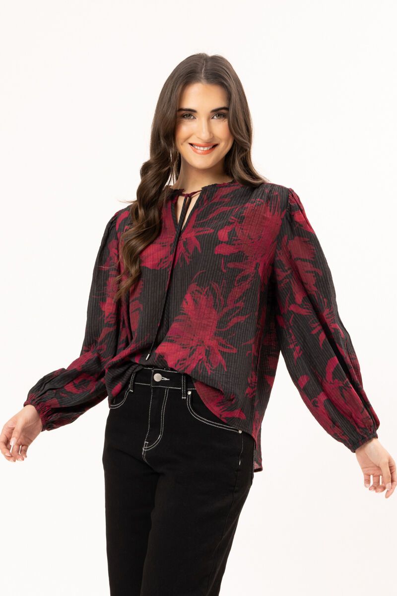 Merlot floral print

Soft ribbed texture

Round neckline with tie keyhole detail

Elasticated cuffs

Relaxed fit

Lightweight, floaty feel

Fabric
86% Viscose, 14% Nylon