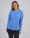 Add a pop of colour to your casual wardrobe with the Foxwood Simplified Crew in Cobalt Blue. This vibrant crew is the ultimate layering piece, designed to bring both comfort and style to your everyday outfits. Featuring a relaxed round neckline, a flattering hi-lo hemline with side splits, and trendy raw edge detailing, this crew offers an effortlessly cool vibe. The embroidered Foxwood logo on the chest adds a touch of signature style, making this a go-to piece for any casual look.

Made from 100% cotton, 