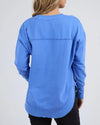 Add a pop of colour to your casual wardrobe with the Foxwood Simplified Crew in Cobalt Blue. This vibrant crew is the ultimate layering piece, designed to bring both comfort and style to your everyday outfits. Featuring a relaxed round neckline, a flattering hi-lo hemline with side splits, and trendy raw edge detailing, this crew offers an effortlessly cool vibe. The embroidered Foxwood logo on the chest adds a touch of signature style, making this a go-to piece for any casual look.

Made from 100% cotton, 