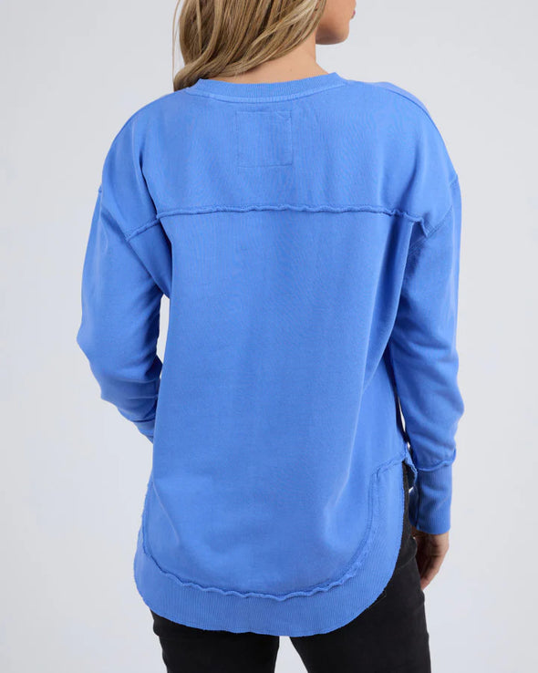 Add a pop of colour to your casual wardrobe with the Foxwood Simplified Crew in Cobalt Blue. This vibrant crew is the ultimate layering piece, designed to bring both comfort and style to your everyday outfits. Featuring a relaxed round neckline, a flattering hi-lo hemline with side splits, and trendy raw edge detailing, this crew offers an effortlessly cool vibe. The embroidered Foxwood logo on the chest adds a touch of signature style, making this a go-to piece for any casual look.

Made from 100% cotton, 