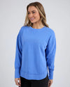 Add a pop of colour to your casual wardrobe with the Foxwood Simplified Crew in Cobalt Blue. This vibrant crew is the ultimate layering piece, designed to bring both comfort and style to your everyday outfits. Featuring a relaxed round neckline, a flattering hi-lo hemline with side splits, and trendy raw edge detailing, this crew offers an effortlessly cool vibe. The embroidered Foxwood logo on the chest adds a touch of signature style, making this a go-to piece for any casual look.

Made from 100% cotton, 