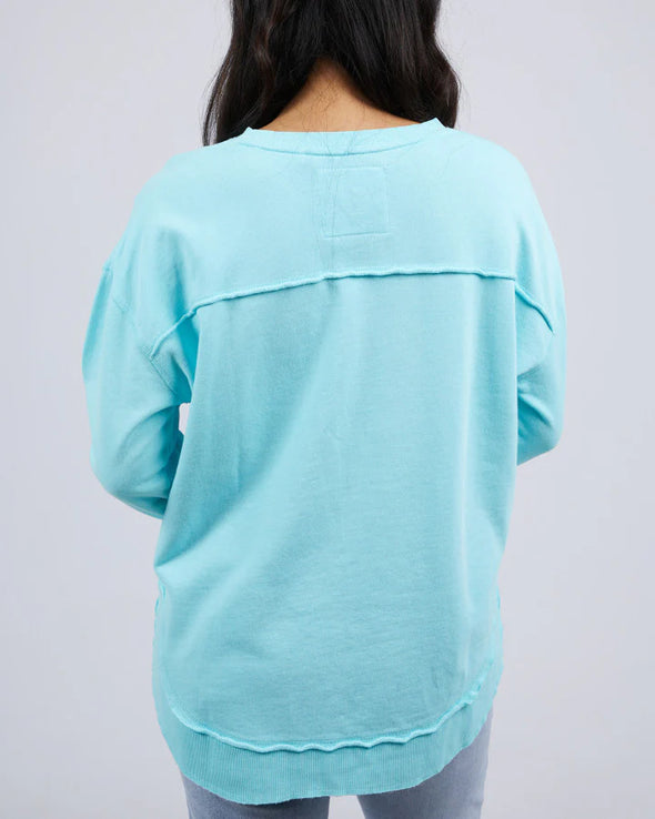 Add a pop of colour to your casual wardrobe with the Foxwood Simplified Crew in Light Blue. This vibrant crew is the ultimate layering piece, designed to bring both comfort and style to your everyday outfits. Featuring a relaxed round neckline, a flattering hi-lo hemline with side splits, and trendy raw edge detailing, this crew offers an effortlessly cool vibe. The embroidered Foxwood logo on the chest adds a touch of signature style, making this a go-to piece for any casual look.

Made from 100% cotton, i