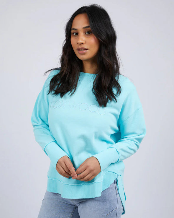 Add a pop of colour to your casual wardrobe with the Foxwood Simplified Crew in Light Blue. This vibrant crew is the ultimate layering piece, designed to bring both comfort and style to your everyday outfits. Featuring a relaxed round neckline, a flattering hi-lo hemline with side splits, and trendy raw edge detailing, this crew offers an effortlessly cool vibe. The embroidered Foxwood logo on the chest adds a touch of signature style, making this a go-to piece for any casual look.

Made from 100% cotton, i