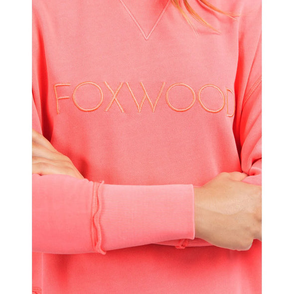 Add a BRIGHT pop of colour to your casual wardrobe with the Foxwood Simplified Crew in Neon Pink. This vibrant crew is the ultimate layering piece, designed to bring both comfort and style to your everyday outfits. Featuring a relaxed round neckline, a flattering hi-lo hemline with side splits, and trendy raw edge detailing, this crew offers an effortlessly cool vibe. The embroidered Foxwood logo on the chest adds a touch of signature style, making this a go-to piece for any casual look.

 100% cotton