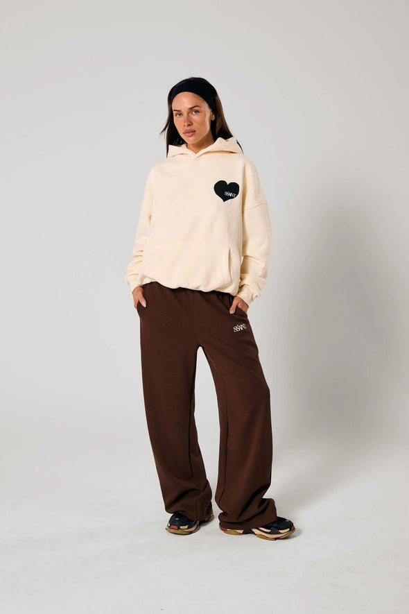 Elevate your off-duty style with the SŚAINT Butter Hoodie – where comfort meets bold design. Crafted from a soft and durable 50% cotton, 50% polyester blend, this fleece-lined hoodie is the perfect throw-on for cooler days.