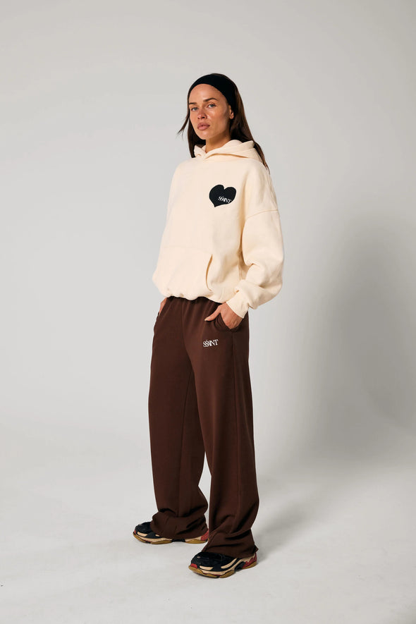 Elevate your off-duty style with the SŚAINT Butter Hoodie – where comfort meets bold design. Crafted from a soft and durable 50% cotton, 50% polyester blend, this fleece-lined hoodie is the perfect throw-on for cooler days.
