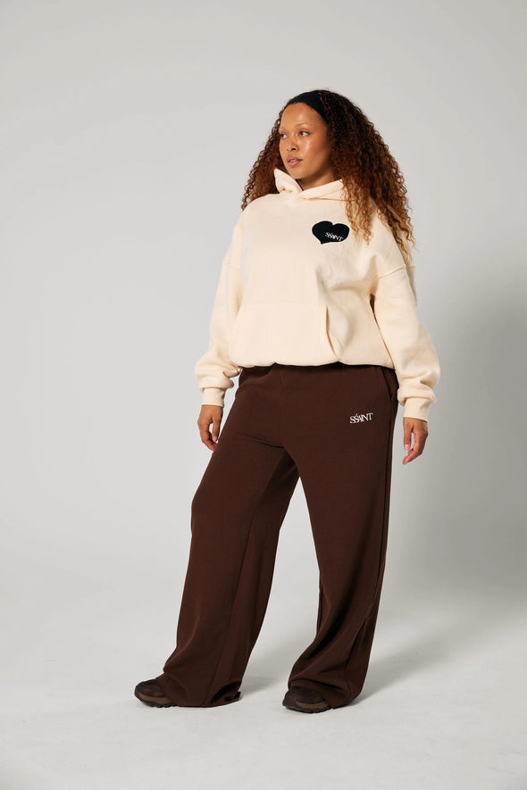 Elevate your off-duty style with the SŚAINT Butter Hoodie – where comfort meets bold design. Crafted from a soft and durable 50% cotton, 50% polyester blend, this fleece-lined hoodie is the perfect throw-on for cooler days.